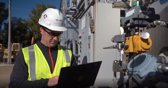 NECI service technician with laptop, valve inspection, valve services