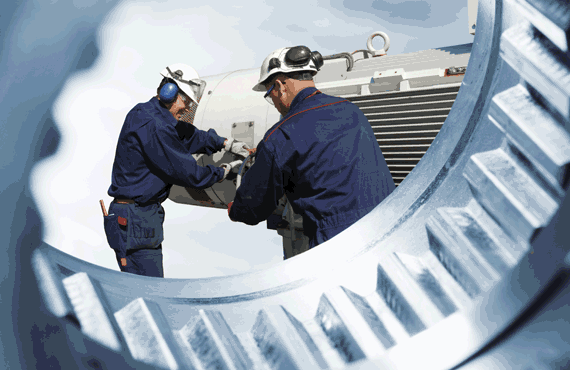 Two men working on a piece of equipment, industrial reliability solutions, asset reliability solutions, asset reliability services